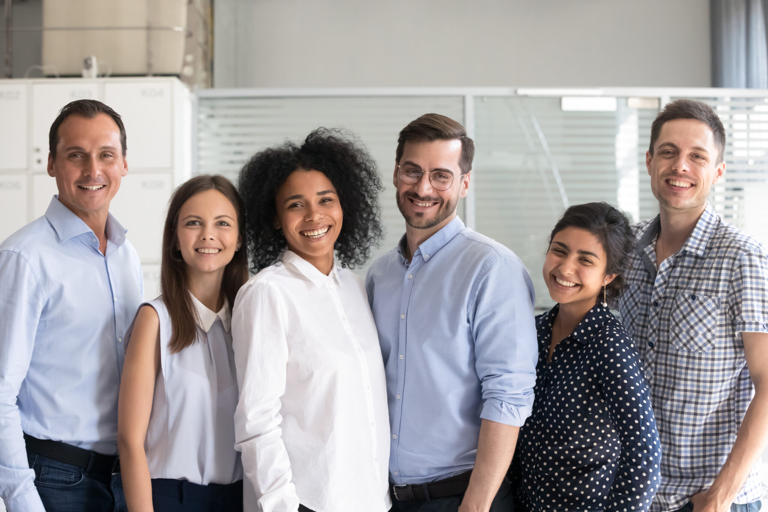 Smiling,Diverse,Office,Workers,Group,,Multiracial,Team,Of,Employees,Looking Home - staff